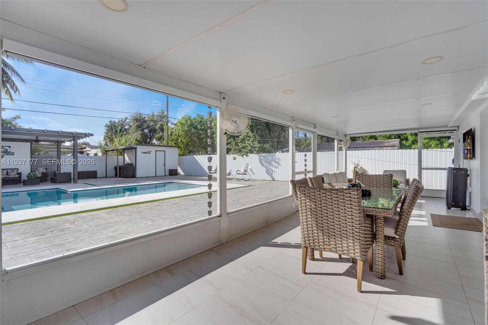 3130 Northwest 102nd Street Miami, FL 33147 - Photo 28 of 42 a dining room with furniture and large windows