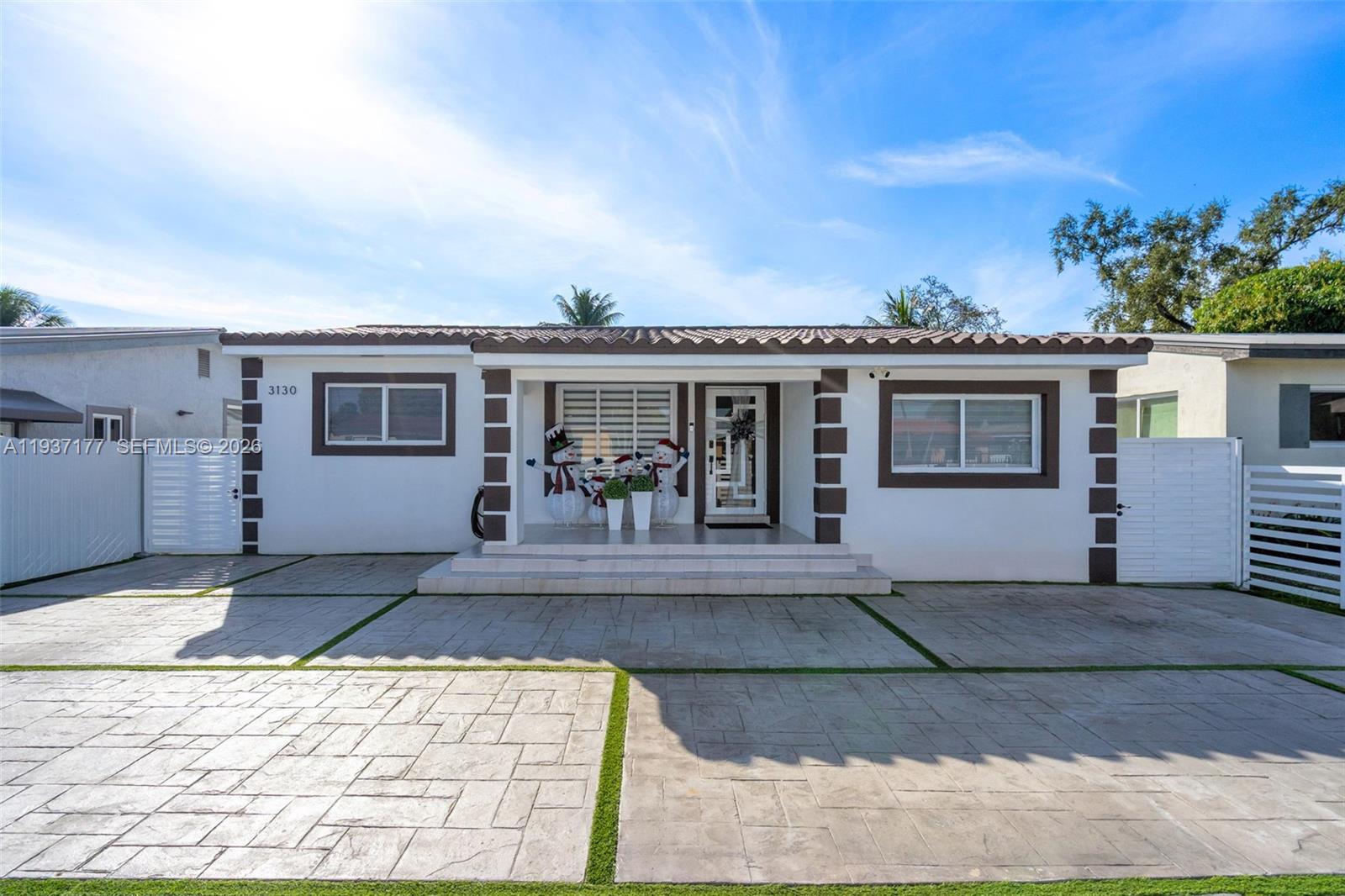 3130 Northwest 102nd Street Miami, FL 33147 - Photo 3 of 42 a view of a house with a patio