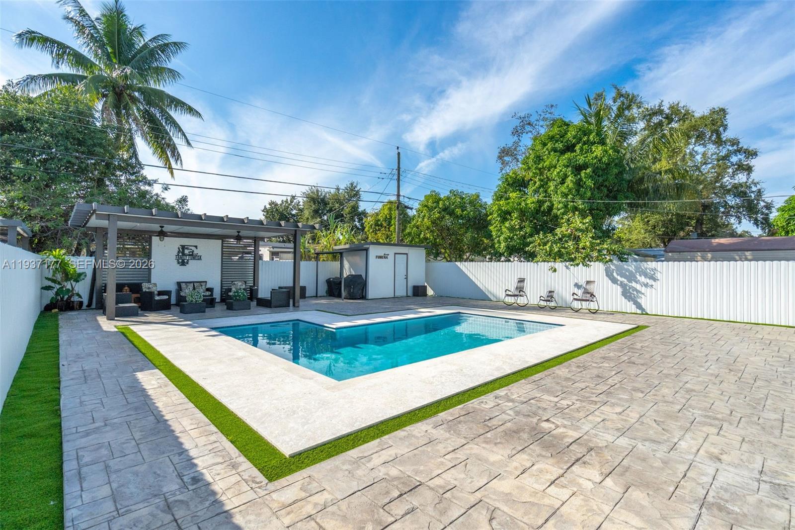 3130 Northwest 102nd Street Miami, FL 33147 - Photo 35 of 42 a view of a house with pool and sitting area