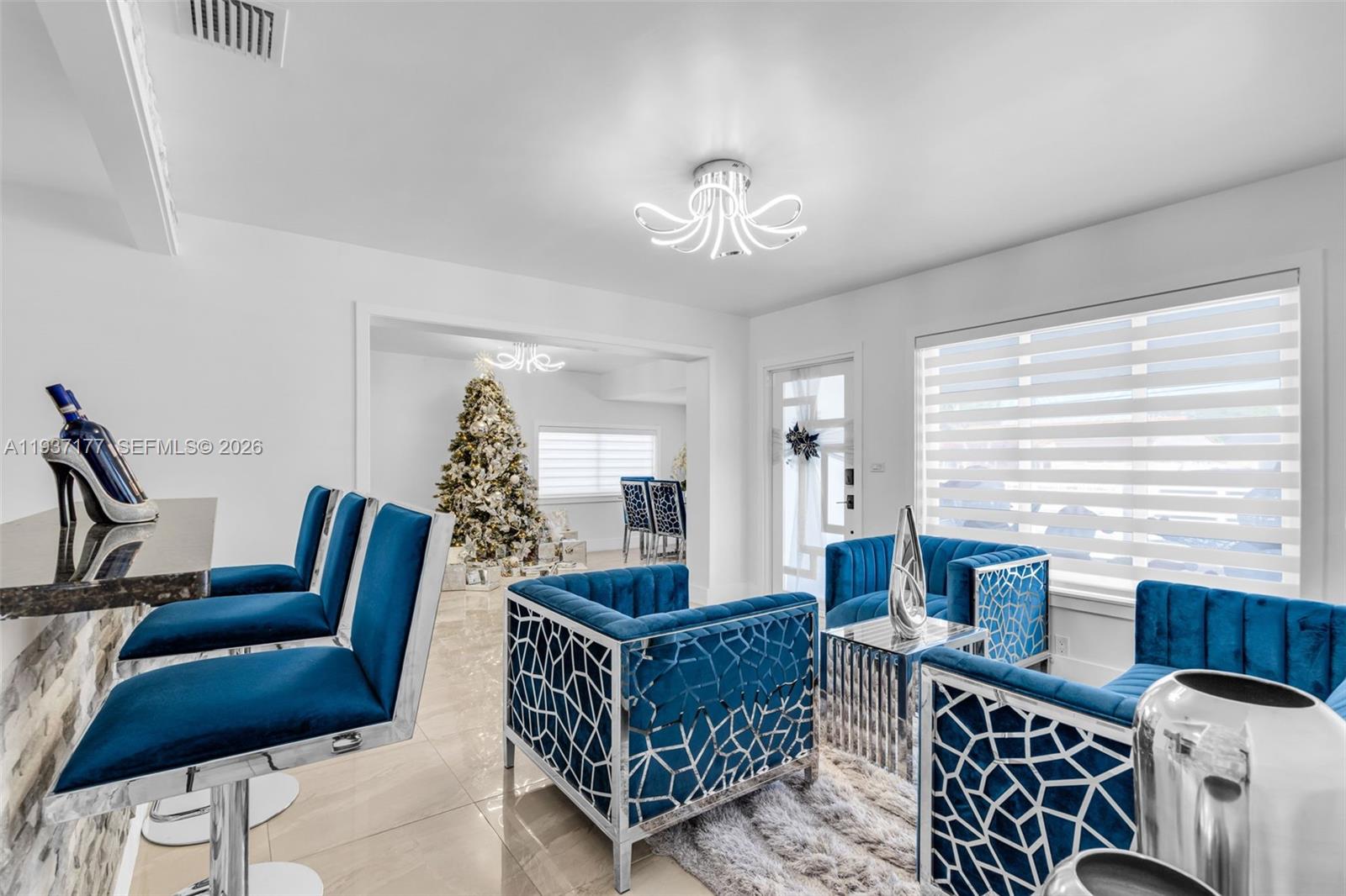 3130 Northwest 102nd Street Miami, FL 33147 - Photo 7 of 42 a living room with furniture and wooden floor