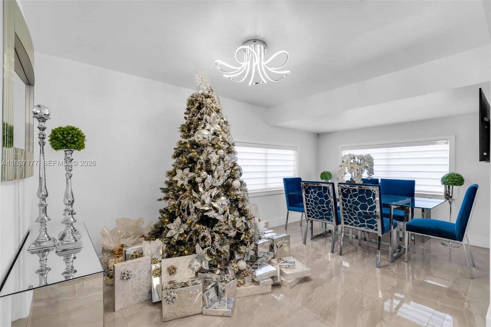 3130 Northwest 102nd Street Miami, FL 33147 - Photo 8 of 42 a view of a dining room with furniture and chandelier