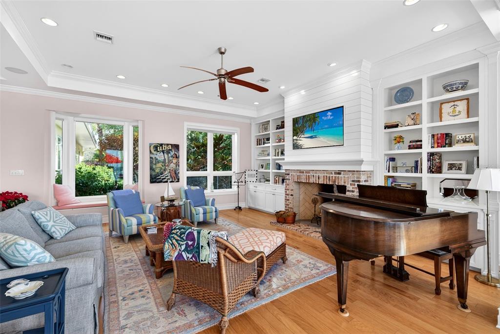 7152 Point Of Rocks Circle Sarasota, FL 34242 - Photo 18 of 88 a living room with fireplace furniture and a flat screen tv