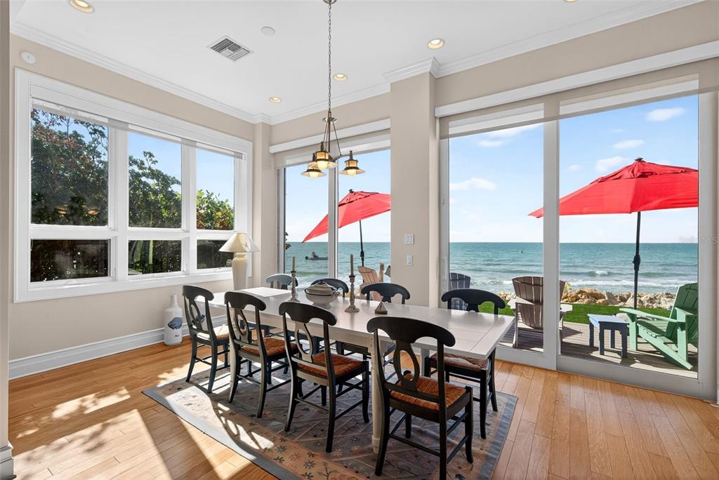 7152 Point Of Rocks Circle Sarasota, FL 34242 - Photo 19 of 88 a view of a dining room with furniture window and wooden floor