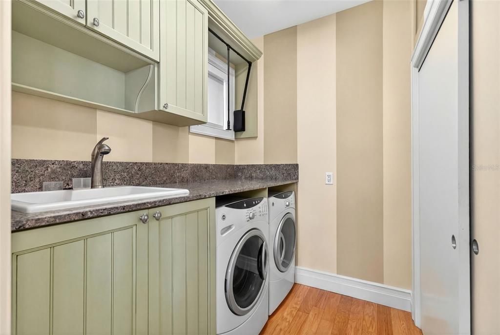 7152 Point Of Rocks Circle Sarasota, FL 34242 - Photo 31 of 88 a utility room with dryer and washer