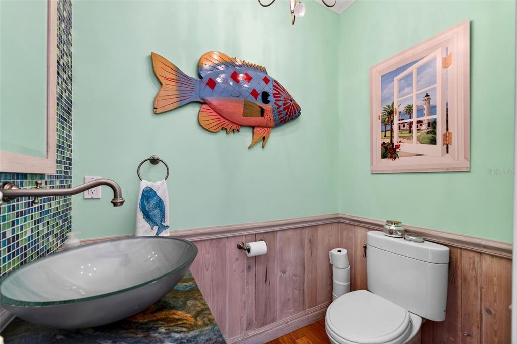 7152 Point Of Rocks Circle Sarasota, FL 34242 - Photo 34 of 88 a bathroom with a toilet sink and mirror