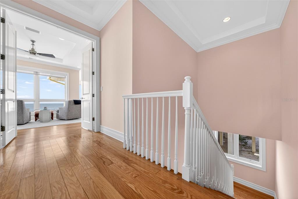 7152 Point Of Rocks Circle Sarasota, FL 34242 - Photo 35 of 88 a view of a hallway with wooden floor and staircase
