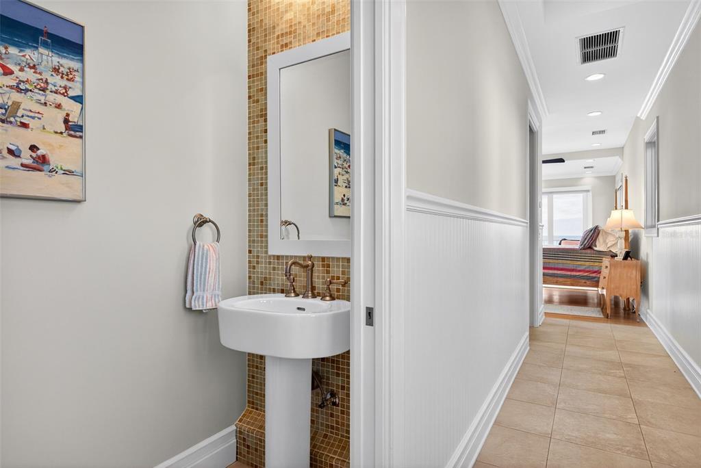 7152 Point Of Rocks Circle Sarasota, FL 34242 - Photo 42 of 88 a bathroom with a sink and a mirror