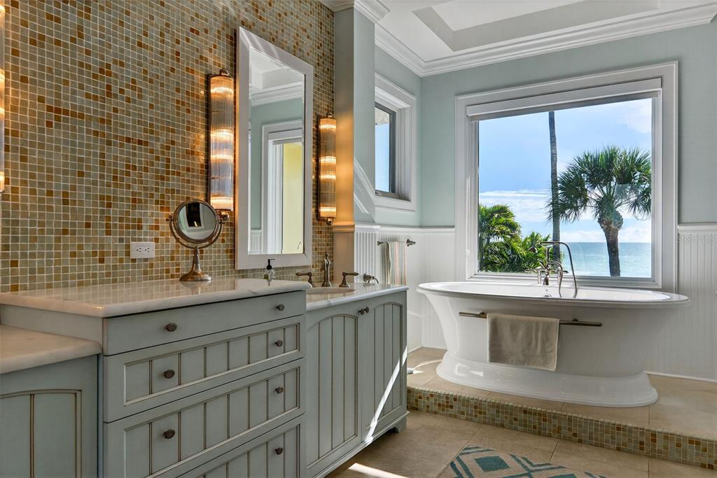 7152 Point Of Rocks Circle Sarasota, FL 34242 - Photo 44 of 88 a bathroom with a double vanity sink and a mirror