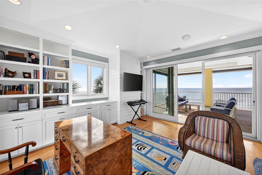 7152 Point Of Rocks Circle Sarasota, FL 34242 - Photo 50 of 88 a living room with fireplace furniture and a flat screen tv