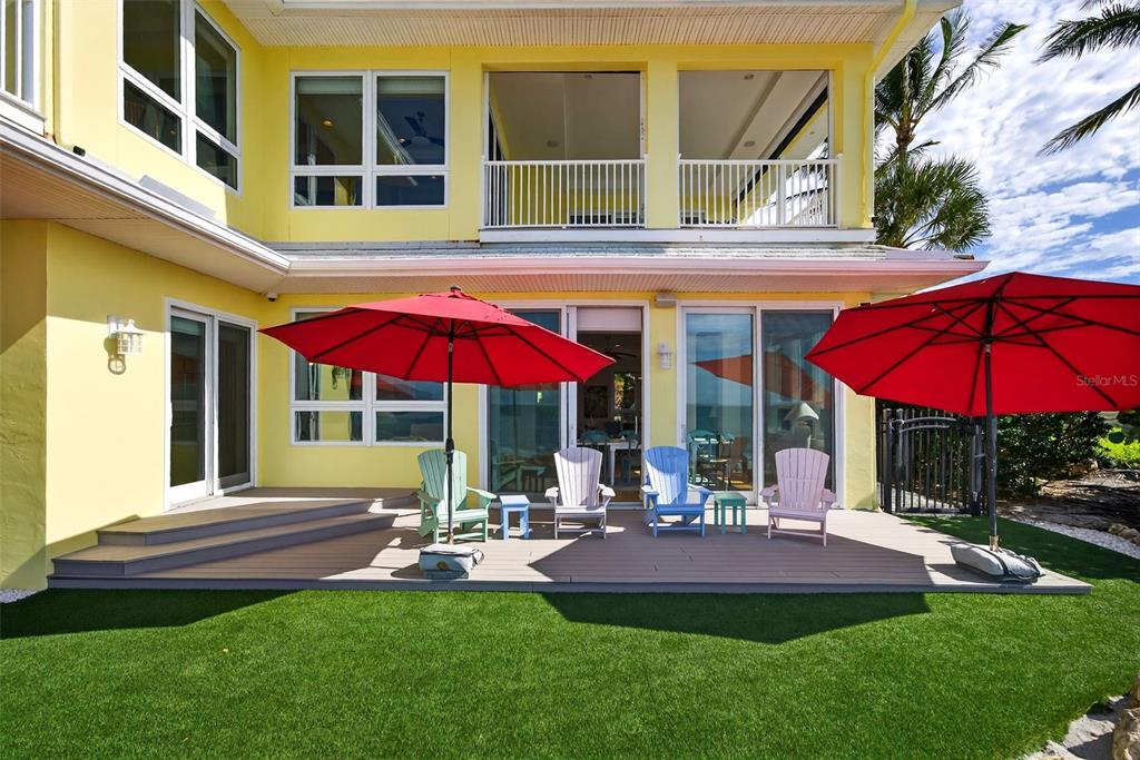 7152 Point Of Rocks Circle Sarasota, FL 34242 - Photo 66 of 88 a view of a house with backyard porch and sitting area