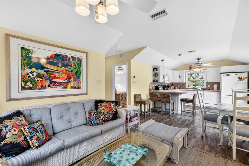 7152 Point Of Rocks Circle Sarasota, FL 34242 - Photo 83 of 88 a living room with furniture and a painting on the wall