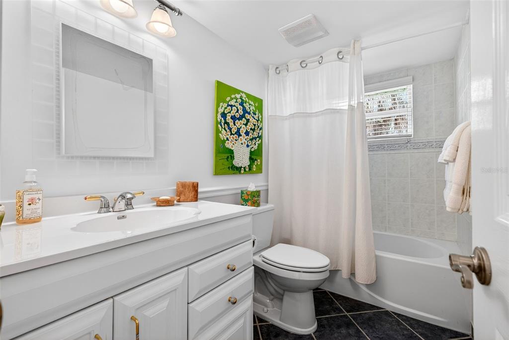 7152 Point Of Rocks Circle Sarasota, FL 34242 - Photo 86 of 88 a bathroom with a sink a toilet and shower