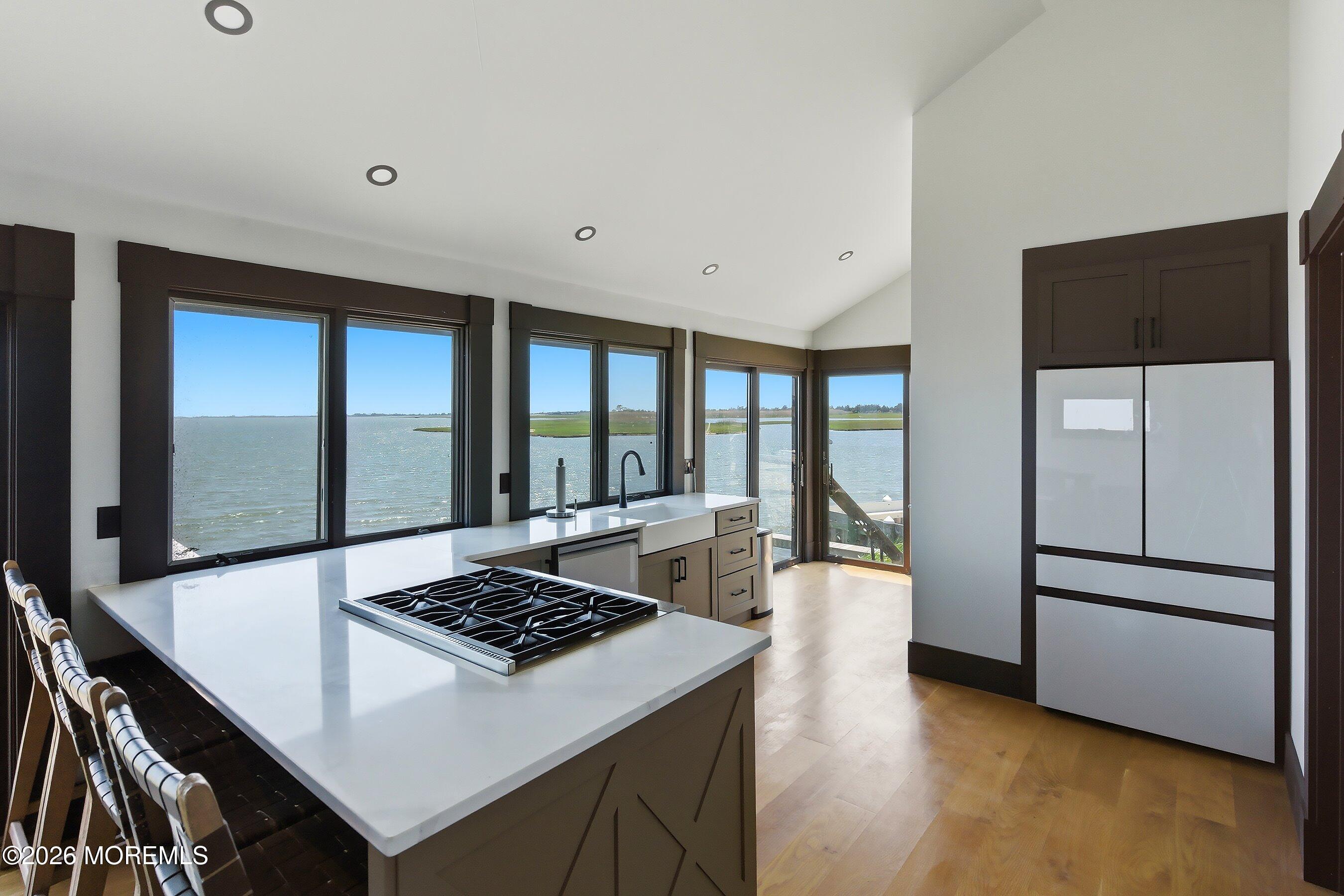 48 Parker Road Tuckerton, NJ 08087 - Photo 5 of 35 a kitchen with a stove a refrigerator and a dining table