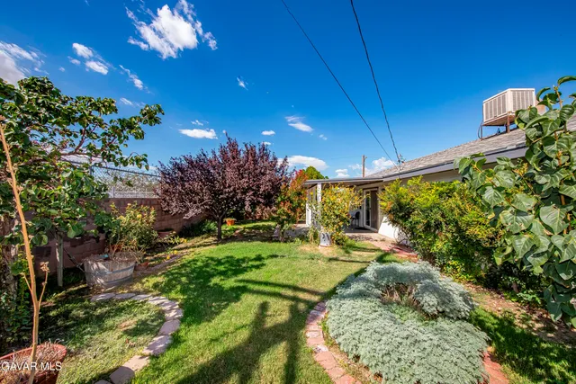 a view of a backyard of the house