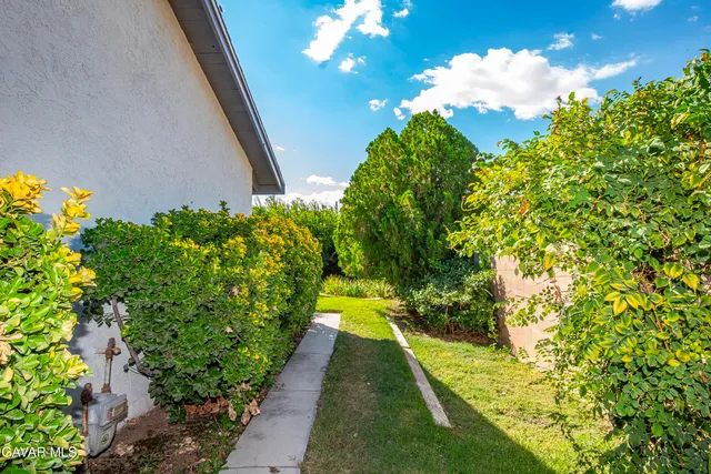 a view of swimming pool from a garden