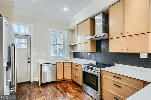 a view of a car park in front of house