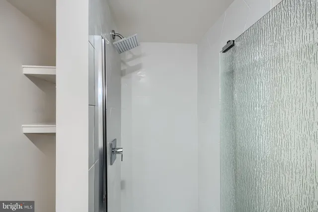 an empty room with wooden floor and closet