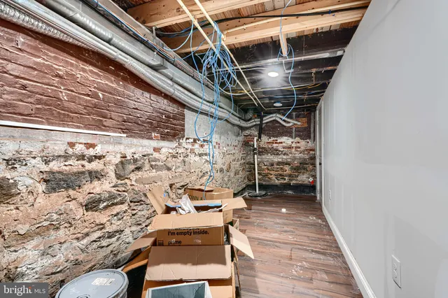 a bedroom with a bed and a fireplace