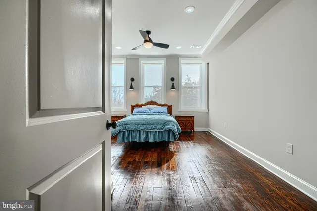 a bathroom with a tub sink vanity and a mirror