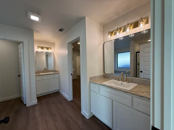 a bathroom with a glass shower door