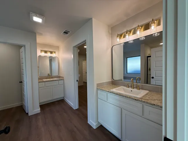 a bathroom with a glass shower door