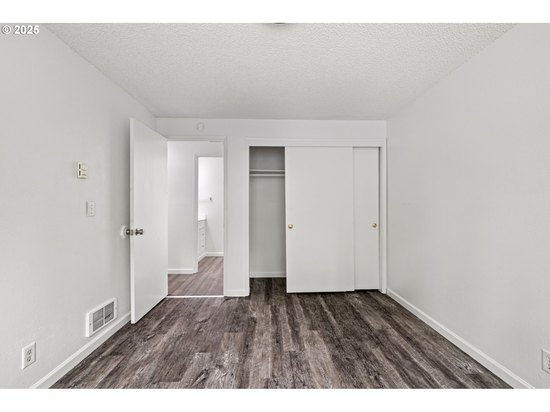 4883 Elderberry Loop Springfield, OR 97478 - Photo 17 of 23 a view of an empty room and wooden floor