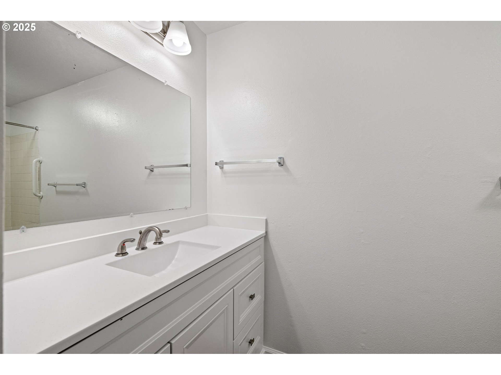 4883 Elderberry Loop Springfield, OR 97478 - Photo 18 of 23 a bathroom with a sink vanity and a mirror