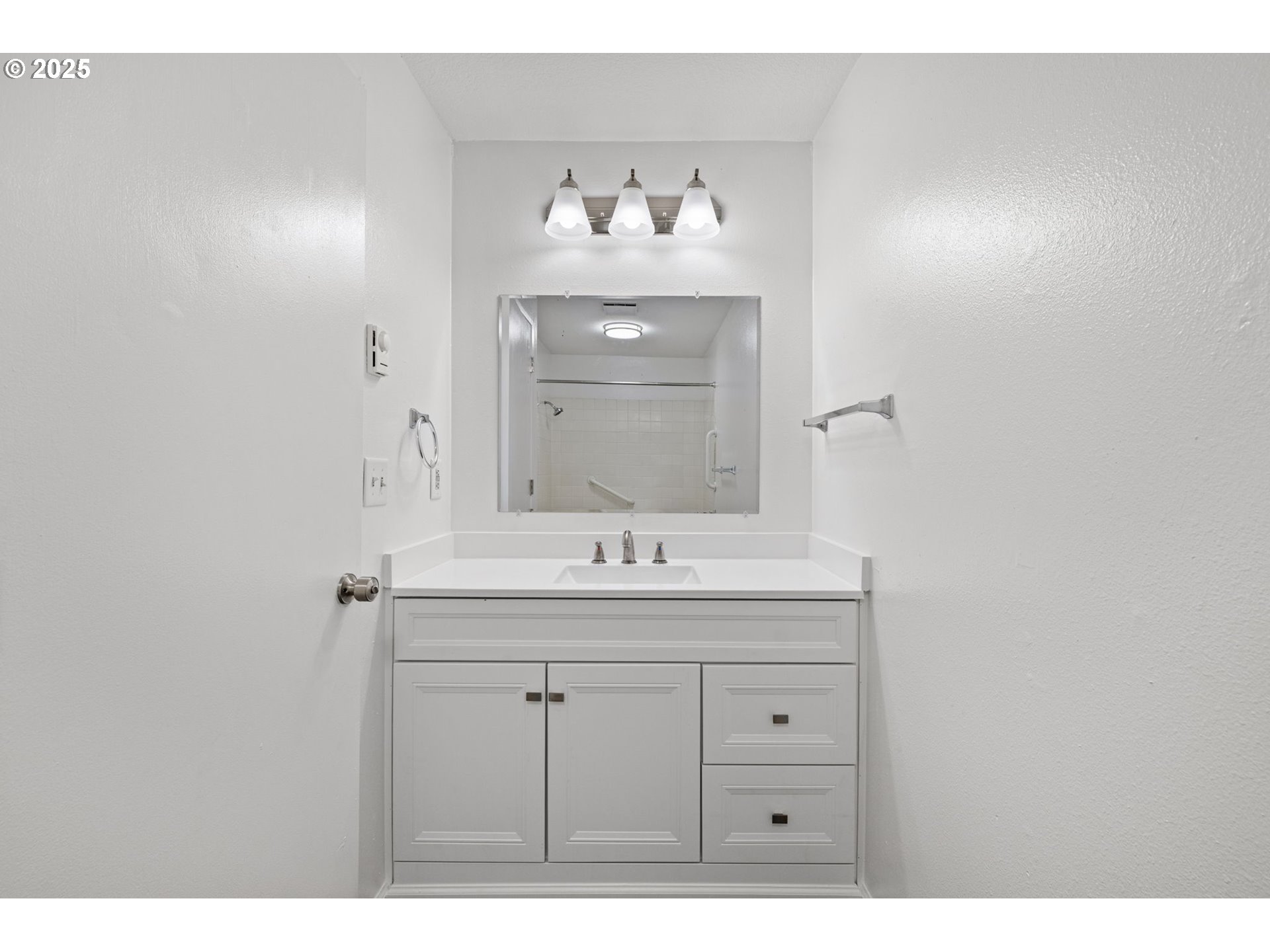 4883 Elderberry Loop Springfield, OR 97478 - Photo 19 of 23 a bathroom with a sink and a mirror