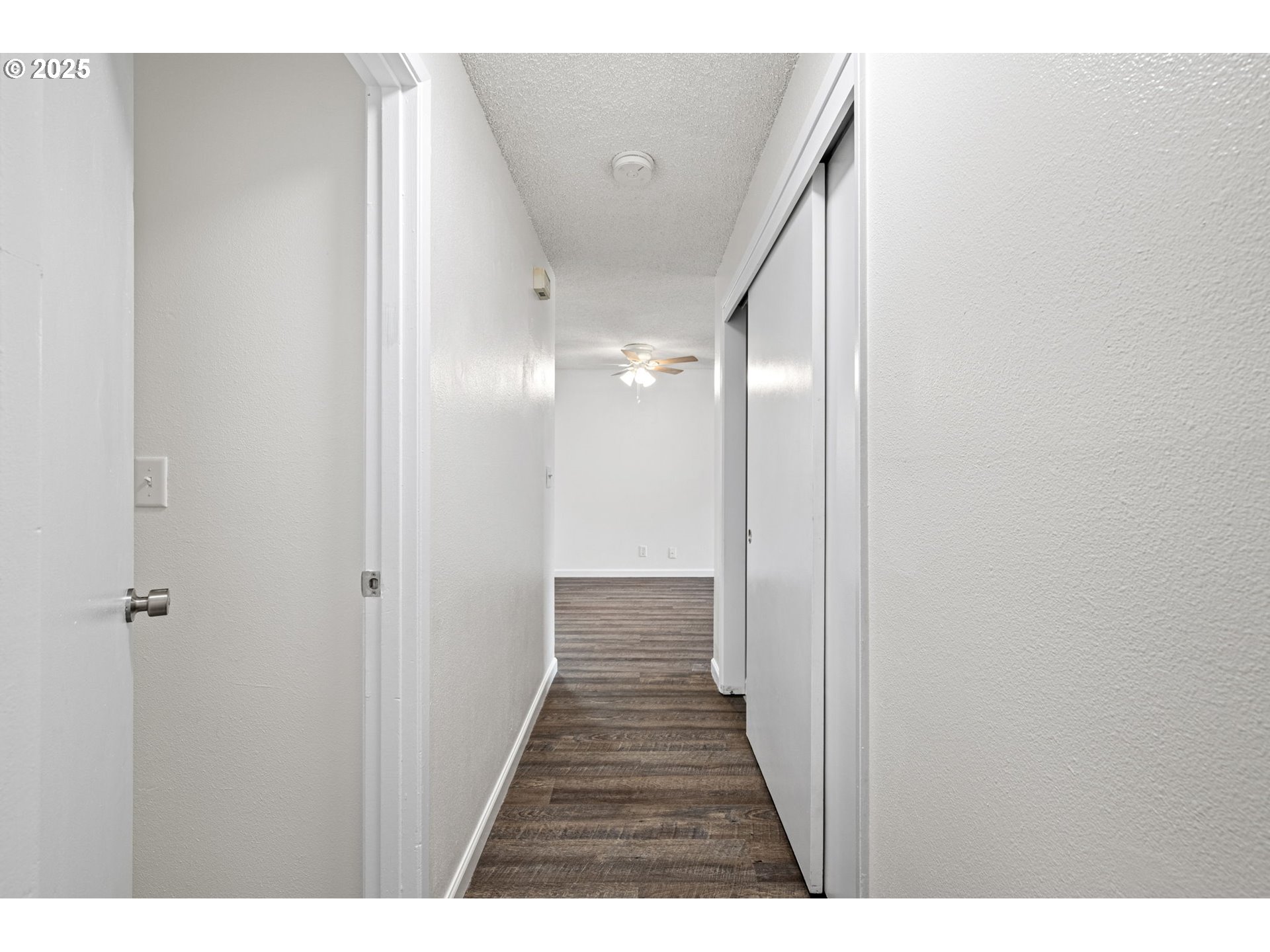4883 Elderberry Loop Springfield, OR 97478 - Photo 21 of 23 a view of a hallway with wooden floor
