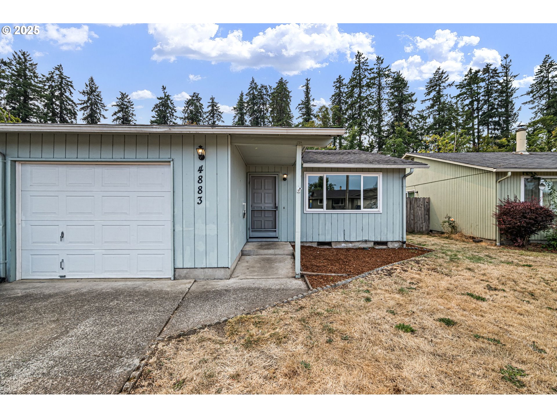 4883 Elderberry Loop Springfield, OR 97478 - Photo 3 of 23 a house with a outdoor space