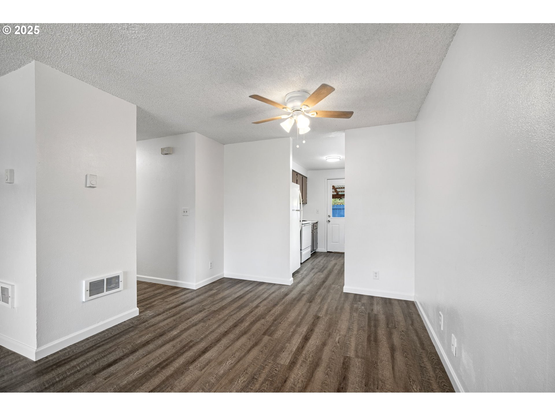 4883 Elderberry Loop Springfield, OR 97478 - Photo 8 of 23 a view of empty room with wooden floor