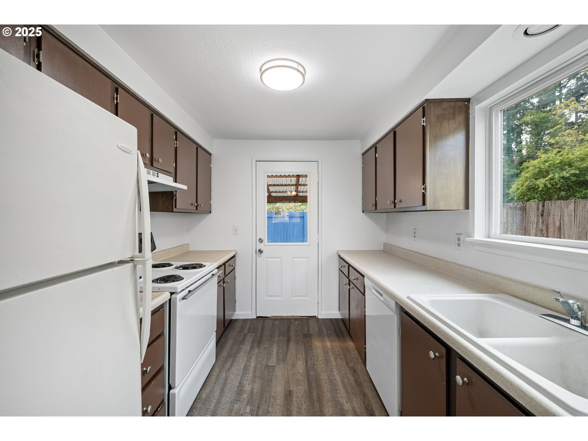 4883 Elderberry Loop Springfield, OR 97478 - Photo 10 of 23 a kitchen with stainless steel appliances granite countertop a sink stove and refrigerator