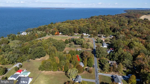 an aerial view of a houses with a yard