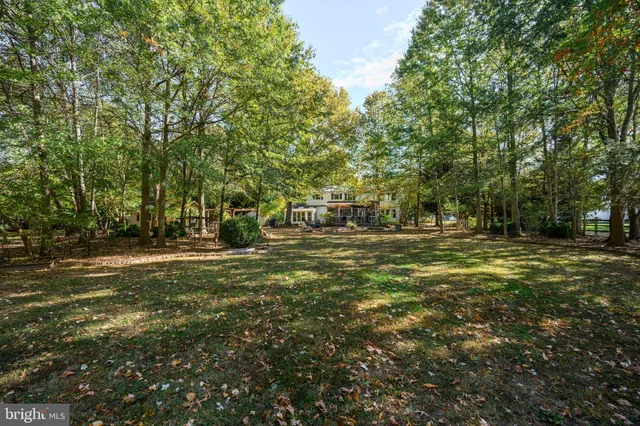 a view of living room with furniture and floor to ceiling window