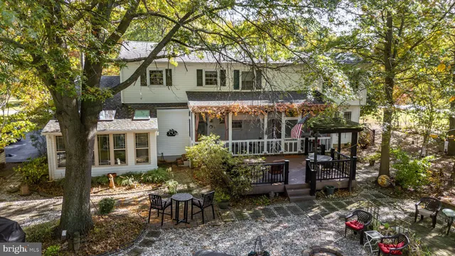 a view of a house with a chairs in patio