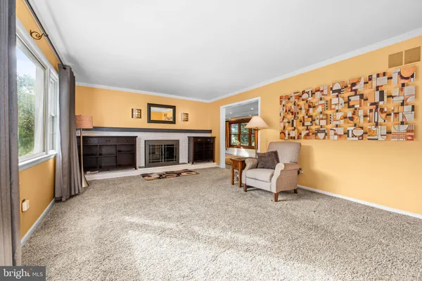 a view of livingroom with hardwood floor and flat screen tv