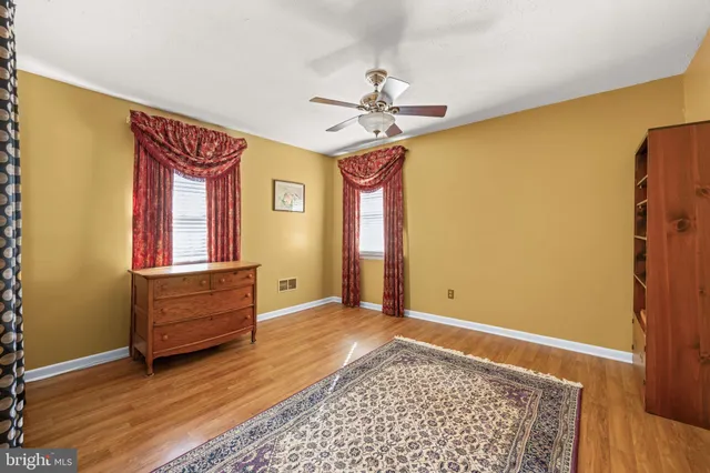 a bed room with a bed and a chandelier
