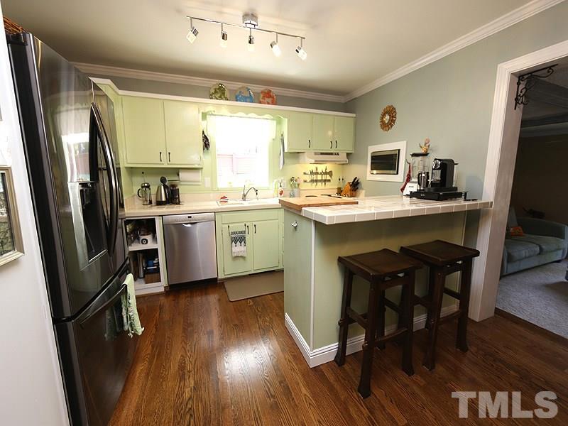 2811 Fordham Lane Raleigh, NC 27604 - Photo 4 of 17 This open, gracious kitchen dining area is the heart of this lovely home.