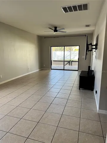 a view of an empty room and a window