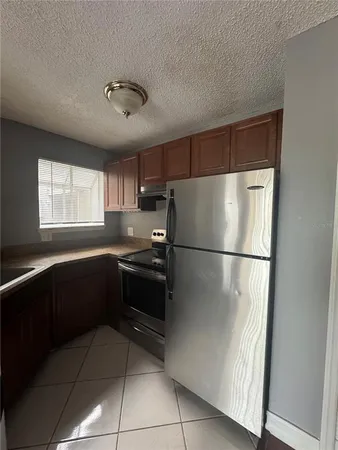 a kitchen with a refrigerator a sink and dishwasher