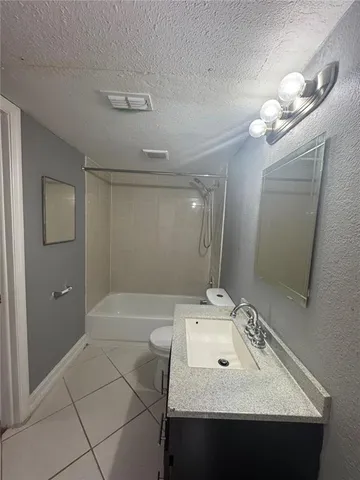 a bathroom with a sink vanity and a mirror
