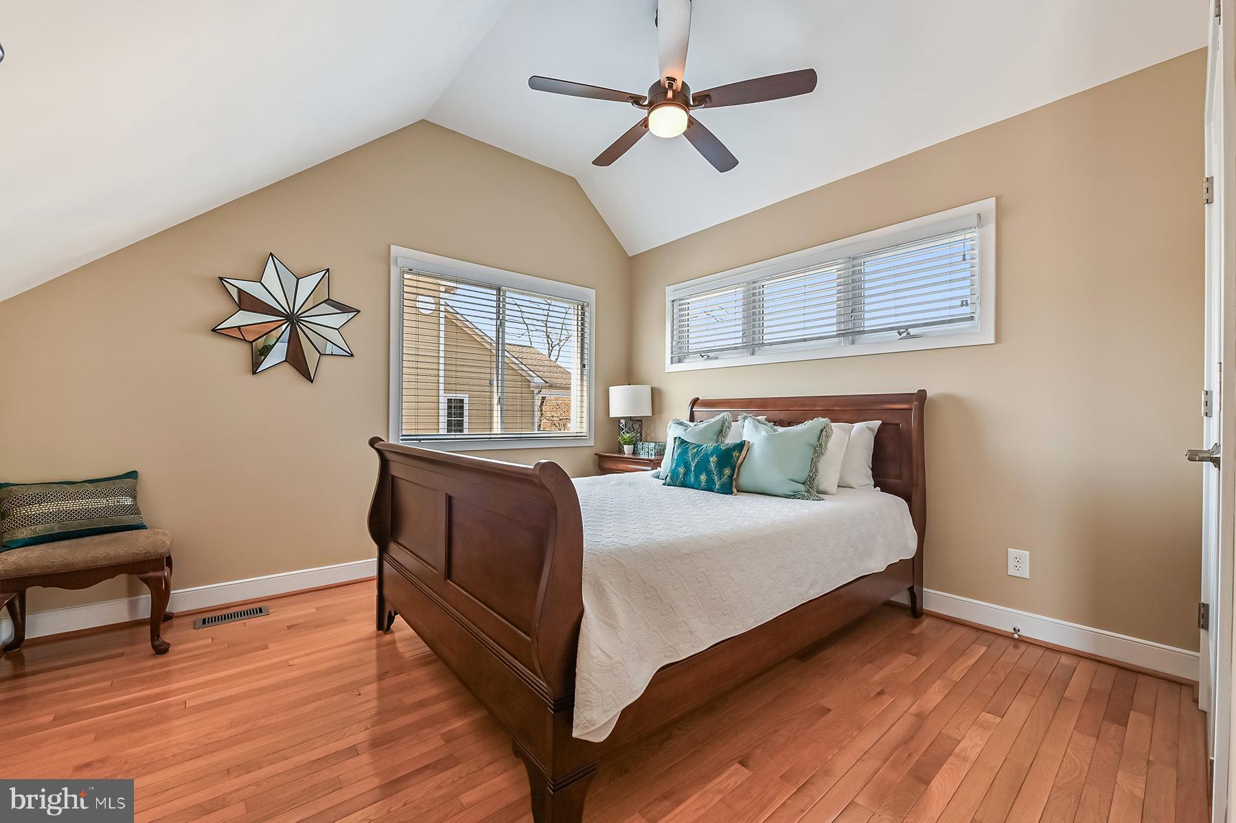 315 Cove Road Riva, MD 21140 - Photo 23 of 38 a bedroom with a bed and a chandelier