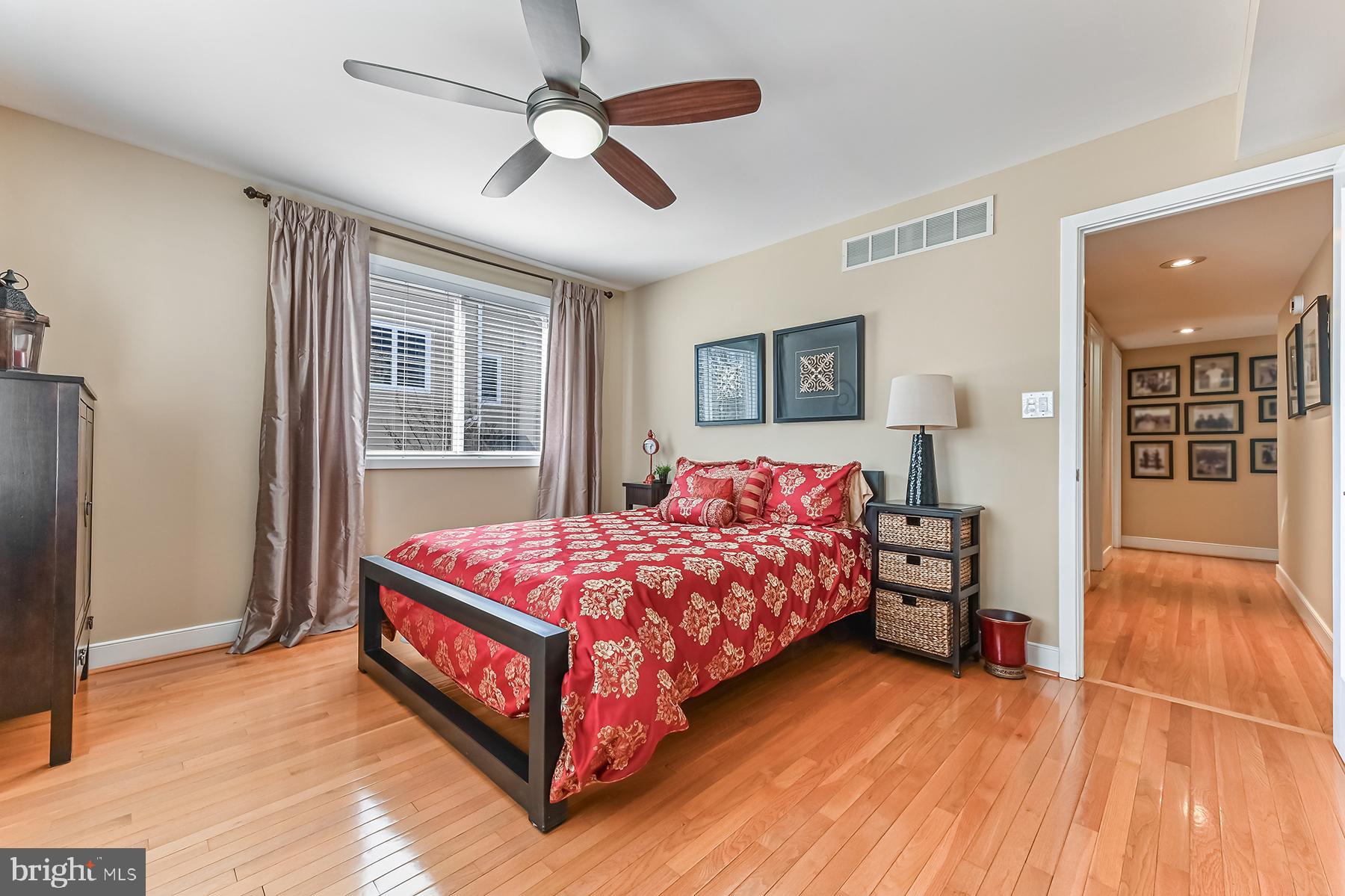 315 Cove Road Riva, MD 21140 - Photo 29 of 38 a bedroom with a large bed chandelier and a window
