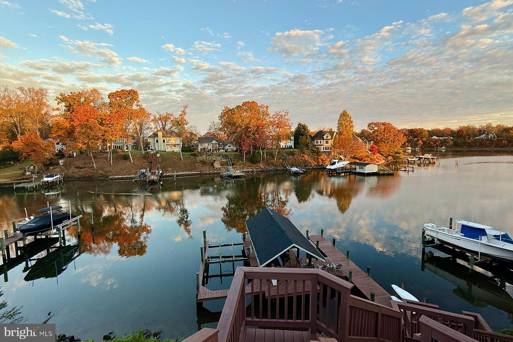 315 Cove Road Riva, MD 21140 - Photo 4 of 38 a view of a lake with boats and trees in the background