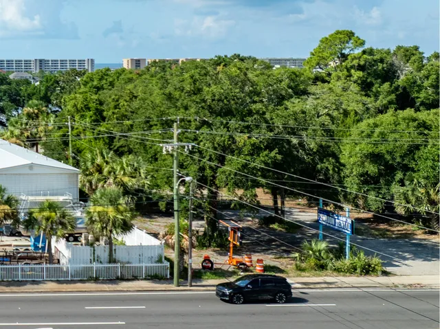 a view of a lake with a table and a chairs