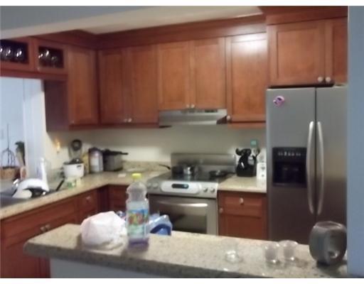 1979 Park Place Boca Raton, FL 33486 - Photo 4 of 10 a kitchen with a sink a stove and refrigerator