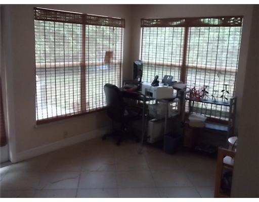 1979 Park Place Boca Raton, FL 33486 - Photo 5 of 10 a living room with furniture and large windows