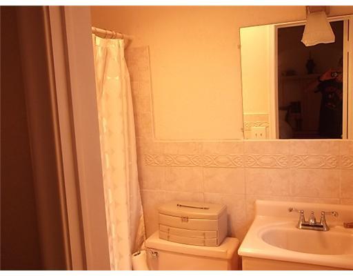 1979 Park Place Boca Raton, FL 33486 - Photo 8 of 10 a bathroom with a sink and a shower curtain