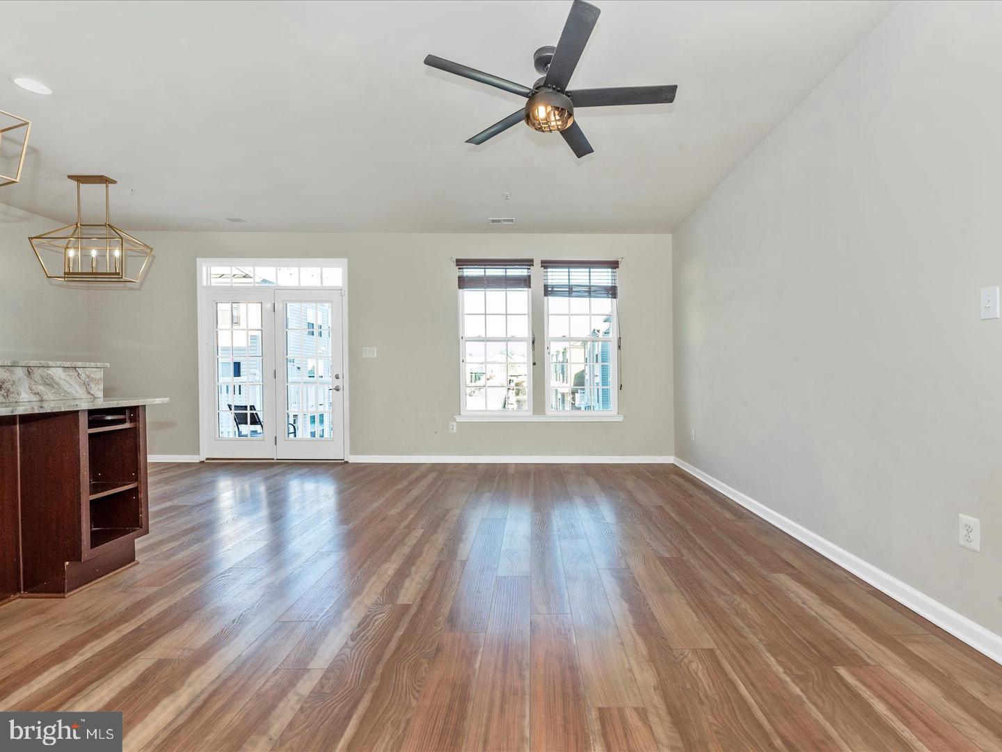 208 B Mill Pond Road Frederick, MD 21701 - Photo 19 of 45 wooden floor in an empty room with a window