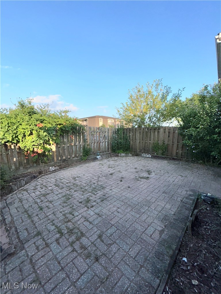 8753 West Ridge Road, Unit A Elyria, OH 44035 - Photo 20 of 21 Fenced backyard with a patio